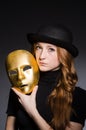 Redhead woman in hat iwith mask in hypocrisy consept