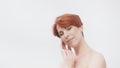 Redhead woman in her 40s posing against white background. Beauty shot Royalty Free Stock Photo