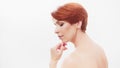 Redhead woman in her 40s posing against white background. Beauty shot Royalty Free Stock Photo