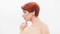Redhead woman in her 40s posing against white background. Beauty shot Royalty Free Stock Photo