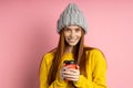 Redhead woman holding disposable cup of coffee Royalty Free Stock Photo