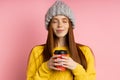 Redhead woman holding disposable cup of coffee Royalty Free Stock Photo