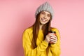 Redhead woman holding disposable cup of coffee Royalty Free Stock Photo