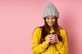 Redhead woman holding disposable cup of coffee Royalty Free Stock Photo