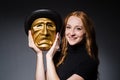 Redhead woman iwith mask in hypocrisy consept against Royalty Free Stock Photo