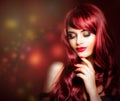 Redhead woman with makeup, long red curly hairstyle Royalty Free Stock Photo