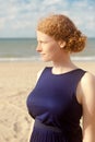 Redhead woman profile beach, De Panne, Belgium