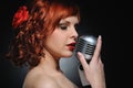 redhead woman with retro microphone Royalty Free Stock Photo
