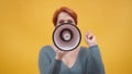 Redhead woman in 40s speaking in loudspeaker Royalty Free Stock Photo