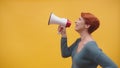 Redhead woman in 40s speaking in loudspeaker Royalty Free Stock Photo