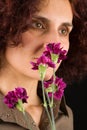 Redhead Woman Smelling Flowers