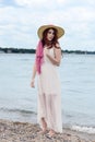 Redhead woman with straw hat at the beach Royalty Free Stock Photo