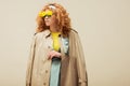 Redhead woman in trench coat and Royalty Free Stock Photo