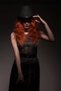 Redhead woman wearing black bowler hat Royalty Free Stock Photo