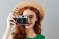 Redhead young cheerful happy lady photographer Royalty Free Stock Photo