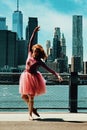 redhead young dancer posing at city street in front of Downton New York City Financial District Royalty Free Stock Photo