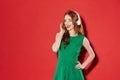 Redhead young happy girl listening music with headphones Royalty Free Stock Photo