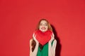 Redhead young happy lady holding plush heart in hands. Royalty Free Stock Photo