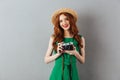 Redhead young smiling positive lady photographer Royalty Free Stock Photo