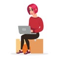 Redheaded girl sitting on cardboard box, looking for work or new flat, houseroom at laptop.
