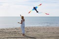 Redheaded model holding kite and posing