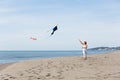 Redheaded model holding kite and posing