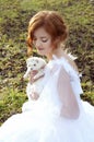Redheaded princess with a white ferret