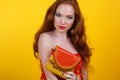 Redheaded smiling girl with fashion purse Royalty Free Stock Photo