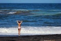 The redhed young woman standing at the sea