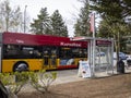 Redmond, WA USA - circa April 2021: View of a Rapid Ride metro bus stopping at a bus stop on a sunny day Royalty Free Stock Photo