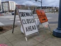 Redmond, WA USA - circa March 2021: Angled view of Sidewalk Closed and Detour signs on a street corner in downtown Redmond Royalty Free Stock Photo