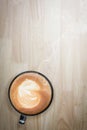 Redolent cappuccino coffee on wooden table. Selective focus.