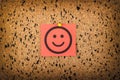 red paper with smiling face on corkboard. bulletin board Royalty Free Stock Photo