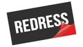 REDRESS text on black red sticker stamp