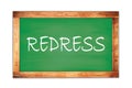 REDRESS text written on green school board