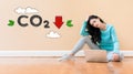 Reduce CO2 concept with woman using a laptop Royalty Free Stock Photo