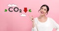 Reduce CO2 concept with young woman Royalty Free Stock Photo