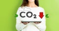 Reduce CO2 with woman holding a tablet