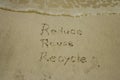 Reduce reuse recycle concept drawn on sand, sustainability