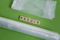 reduce, reuse and recycle word in vintage wooden letterpress type blocks, flatlay on green font Royalty Free Stock Photo