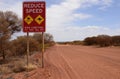 Reduce Speed Road Sign in Outback Australia.. Royalty Free Stock Photo