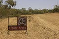 Reduce speed sign on a deserted stretch of road works in outback Queensland, Australia Royalty Free Stock Photo