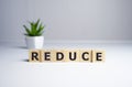 Reduce word written on wood block. reduce, reuse and recycle text on wooden table for your desing, concept