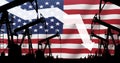 Oil pump on flag of US background. Reduction or increase in level of oil production in United States Oil and gas production. USA Royalty Free Stock Photo