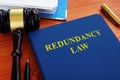 Redundancy law book with gavel