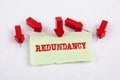 Redundancy. Note sheet and red arrows on white paper background Royalty Free Stock Photo