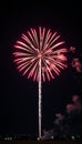 Redwhiteblue firework explosion lighting up the night sky Royalty Free Stock Photo