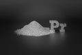 REE - rare-earth element Praseodymium. A handful of silvery-white metallic powder and the chemical symbol Pr on a black