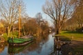 A reed barge in the canal of a Dutch village Royalty Free Stock Photo