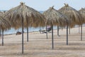 Reed beach umbrellas by the sea or ocean. Rest on the adriatic sea